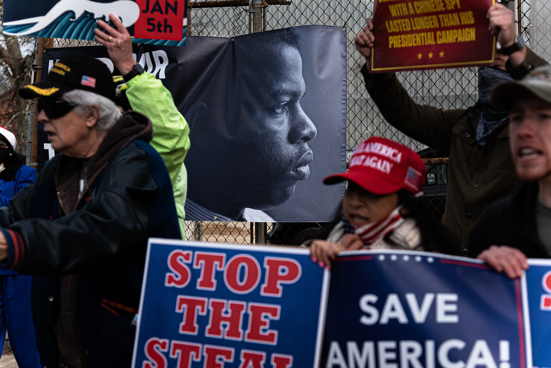 December 15, 2020 - Atlanta, GA. Pro-Trump demonstrators outside of a drive-in rally for Georgia Democratic U.S. Senate candidates Jon Ossoff and Raphael Warnock.