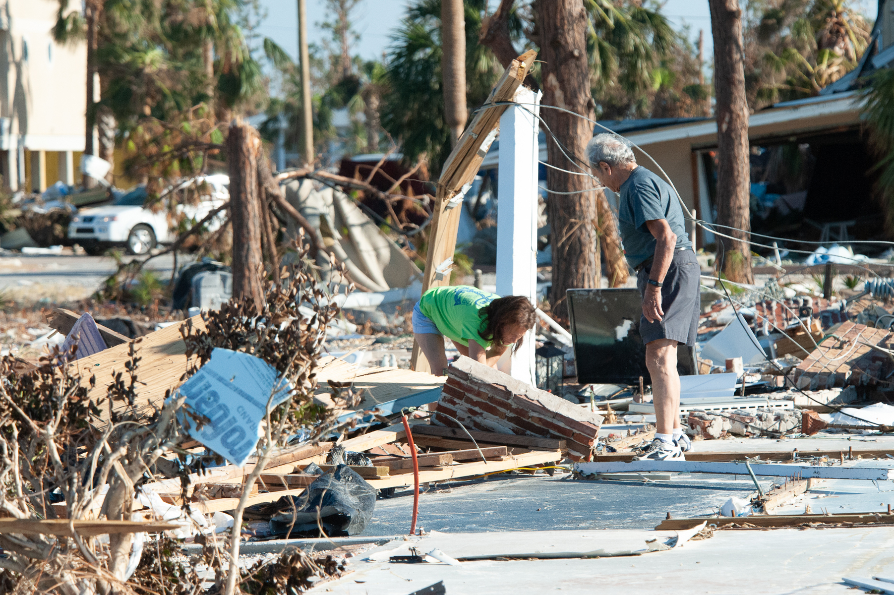 October 18, 2018 - Mexico Beach, FL - George Mamary and his daugther Adlette of Atlanta, GA  survey's what is left of their vacation home in Mexico Beach, Florida after Hurricane Michael as passed through the area on October 15, 2018 in Mexico Beach, Florida.  The hurricane hit the Florida Panhandle as a category 5 storm causing massive damage and claimed the lives of more then a dozen people.