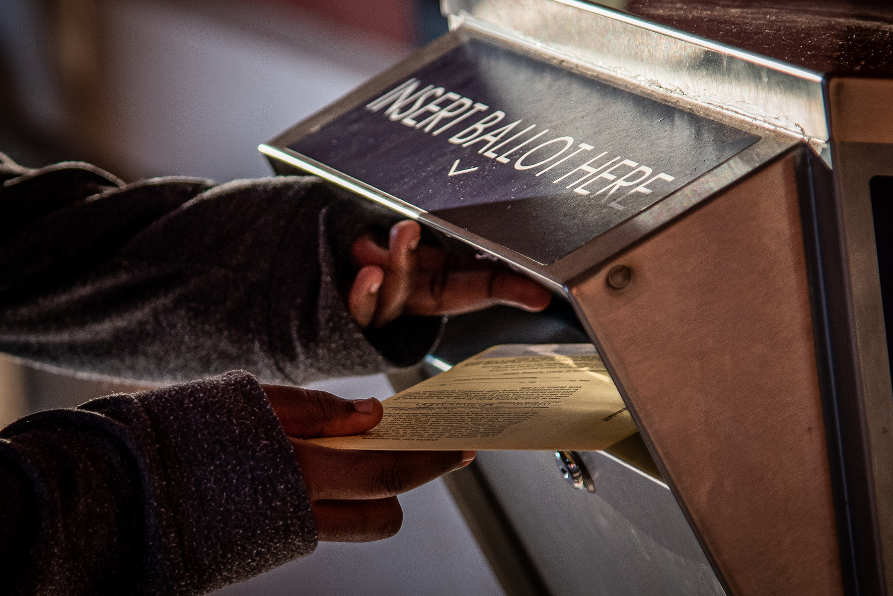 December 17, 2020 – Marietta, GA. A voter drops off a ballot during the U.S Senate run-off race.